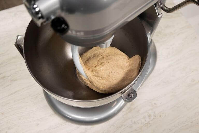 https://www.escoffier.edu/wp-content/uploads/2017/08/Electric-mixer-using-the-hook-attachment-to-mix-bread-dough-768.jpeg