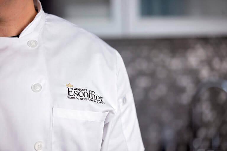 https://www.escoffier.edu/wp-content/uploads/2021/04/Escoffier-white-chef-coat-with-logo-768.jpeg