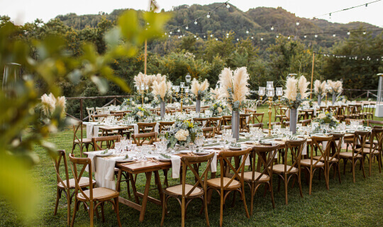 Wedding table set up in boho style with pampas grass and greenery