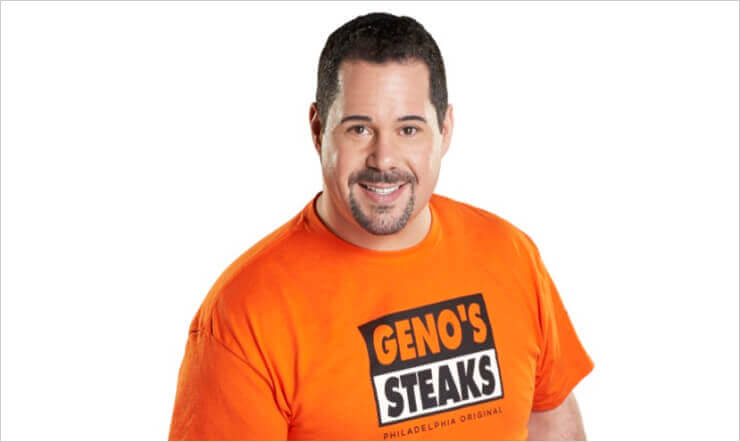 Escoffier Graduate Geno Vento wearing Geno's Steaks Philadelphia Original orange t-shirt