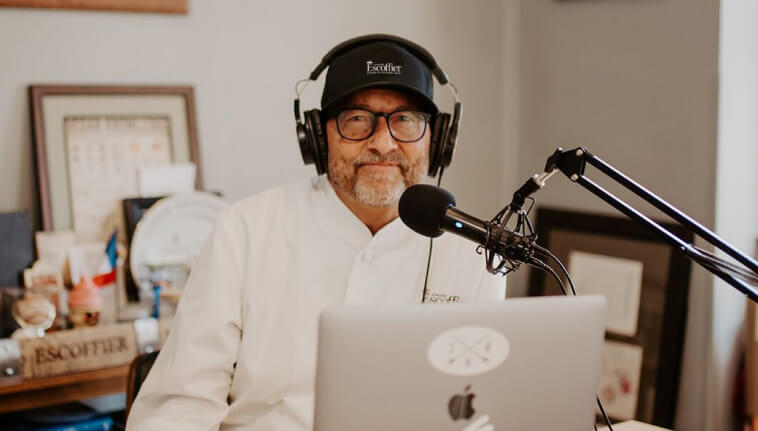 Kirk Bachmann wearing headphones and smiling